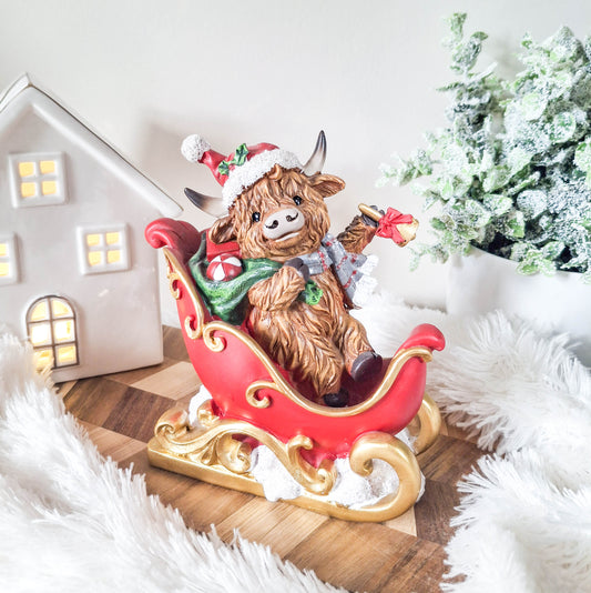 Christmas Highland Cow in Sleigh