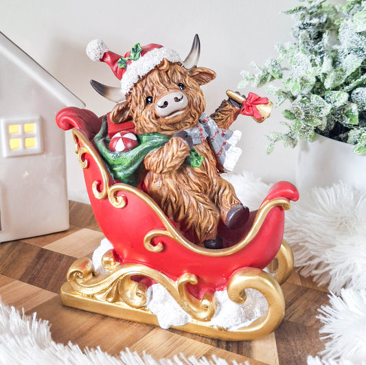 Christmas Highland Cow in Sleigh